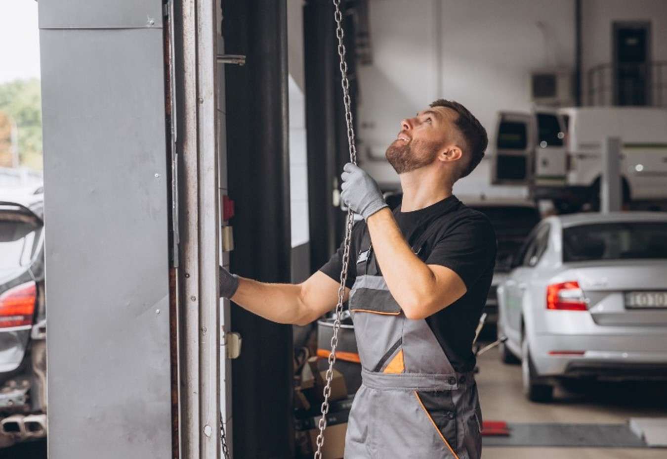 A Worker from A1A Overhead Door Repairs a Garage Door in Jacksonville, FL