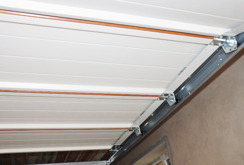 Close-up of garage door panels and track system installation in Jacksonville, FL