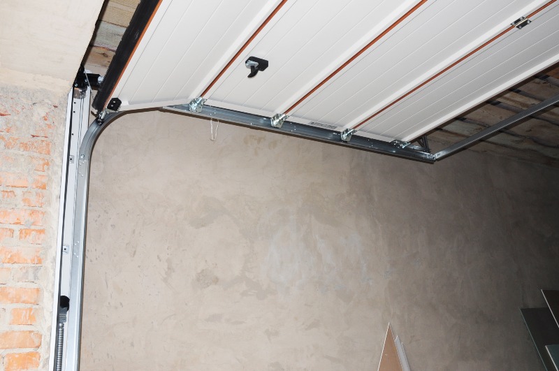 Interior view of garage door track and panel system installation in Jacksonville, FL