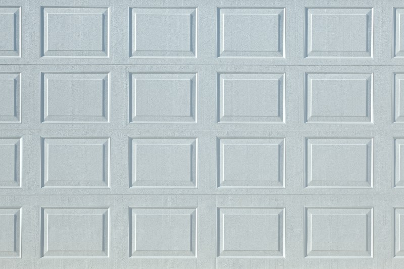 White sectional garage door panel design and texture detail in Jacksonville, FL
