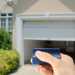 person holding garage door opener