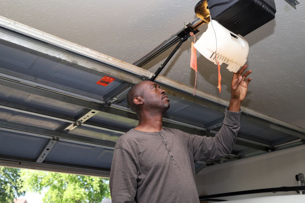 Man Checking Garage Door Opener