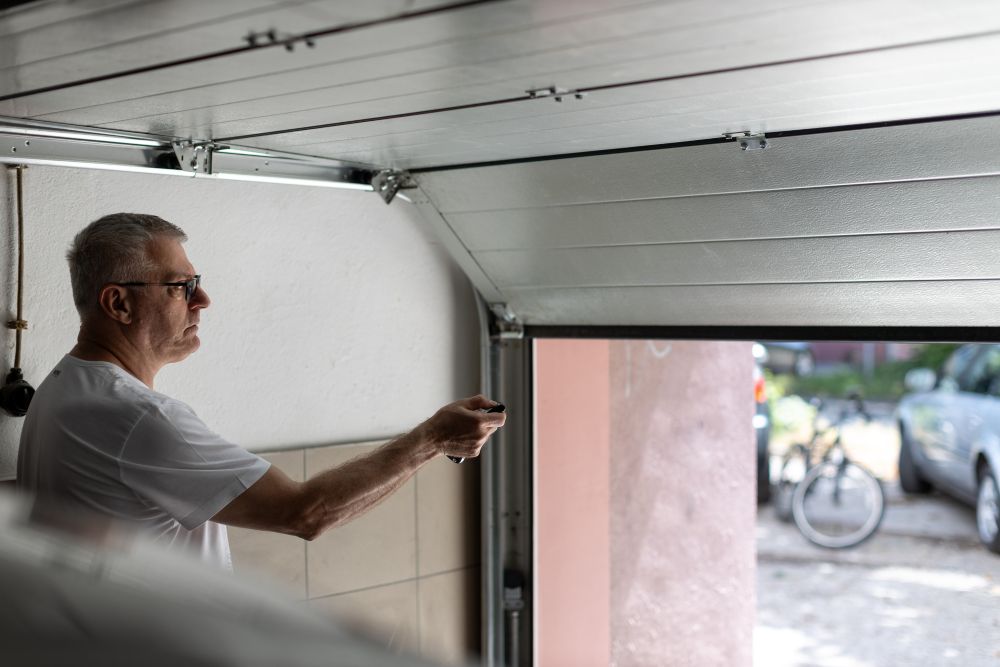 Man Testing His Garage Door Opener