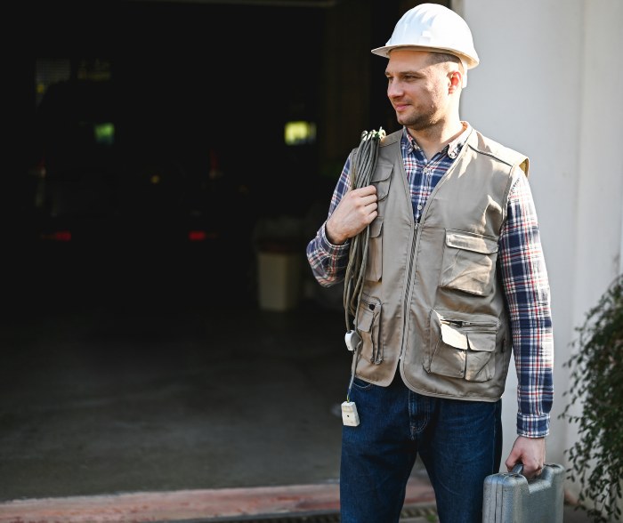 Man working on Garage Door of a Residential Area in FL